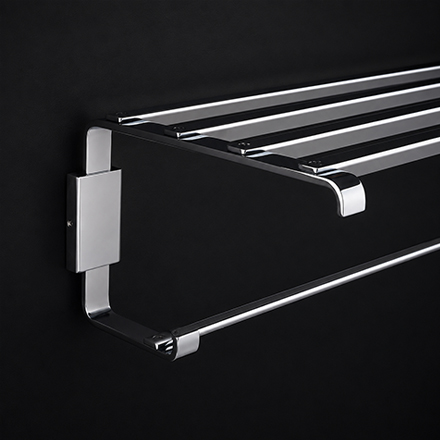 Twist towel rack with dark textured rail and polished brass mounts