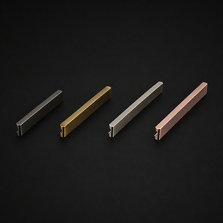 Dark textured cabinet pull handle with polished brass mounts