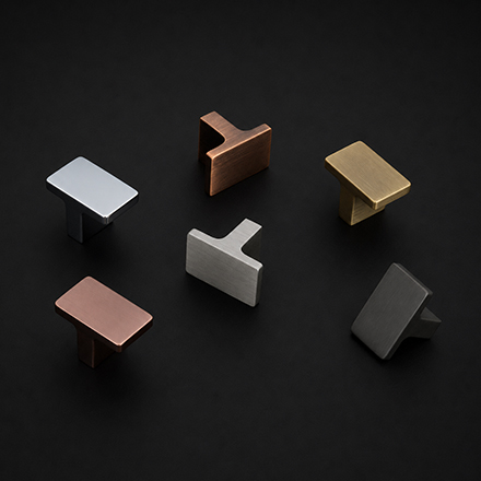 Dark diamond-knurled cabinet knob with polished brass stem