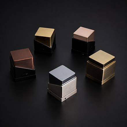Dark textured knurled T-bar cabinet knob with brass accents