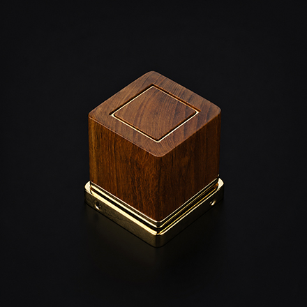 Fluted wooden cabinet knob with a brass base