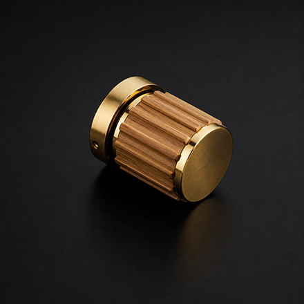 Dark wood round cabinet knob with a brass base