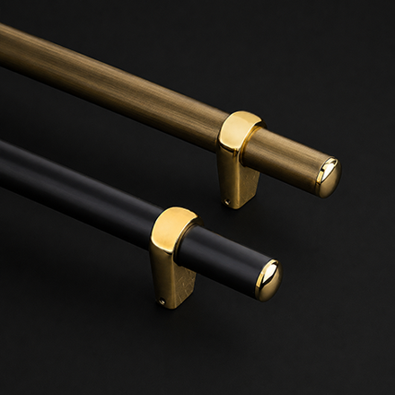 Dark textured pull handle with polished brass end brackets