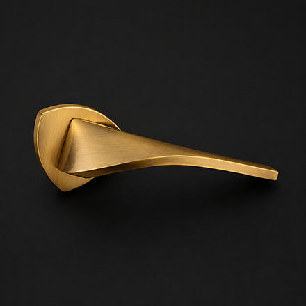 Modern brass and dark textured lever door handle on a round rose
