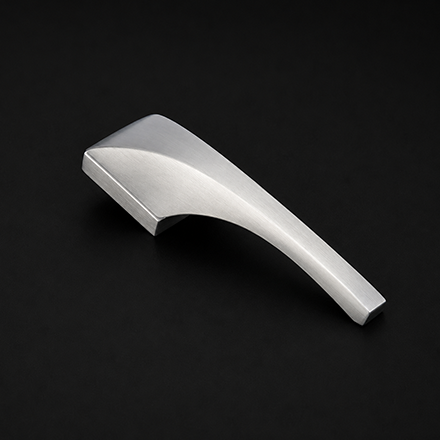 Minimalist black and brass lever door handle on a round rose